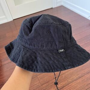 Black TNA bucket hat. Never worn. Sitting in storage.